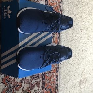 Blue Adidas running shoes